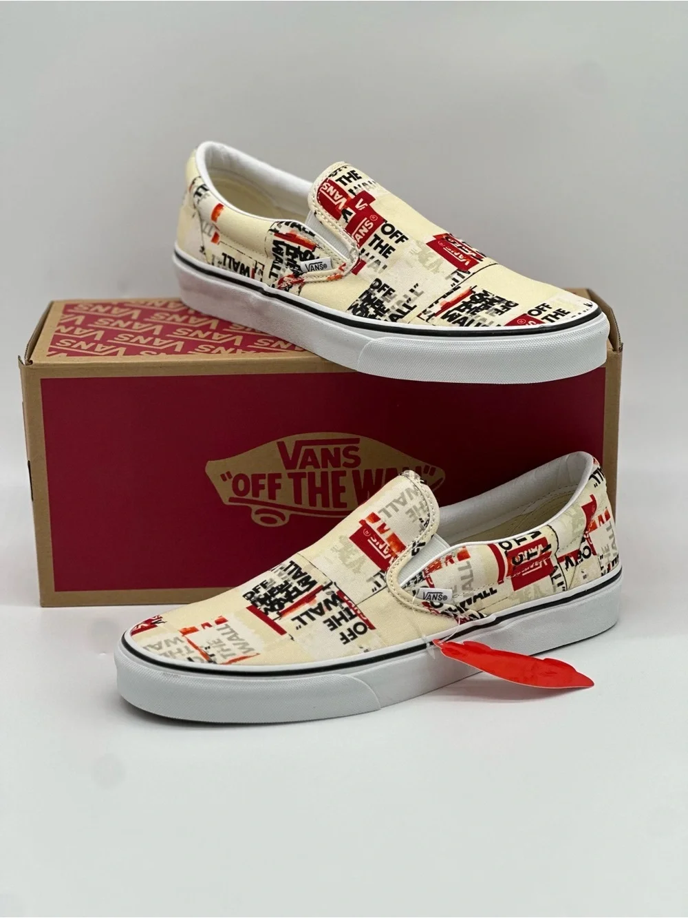 Vans Slip-On Sneakers in Cream, Red & Black Graphic Print